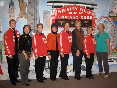 Team photo in front of the Chicago background painted by Marilyn Wilson